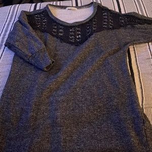 Love fire sweater with black crochet on top.